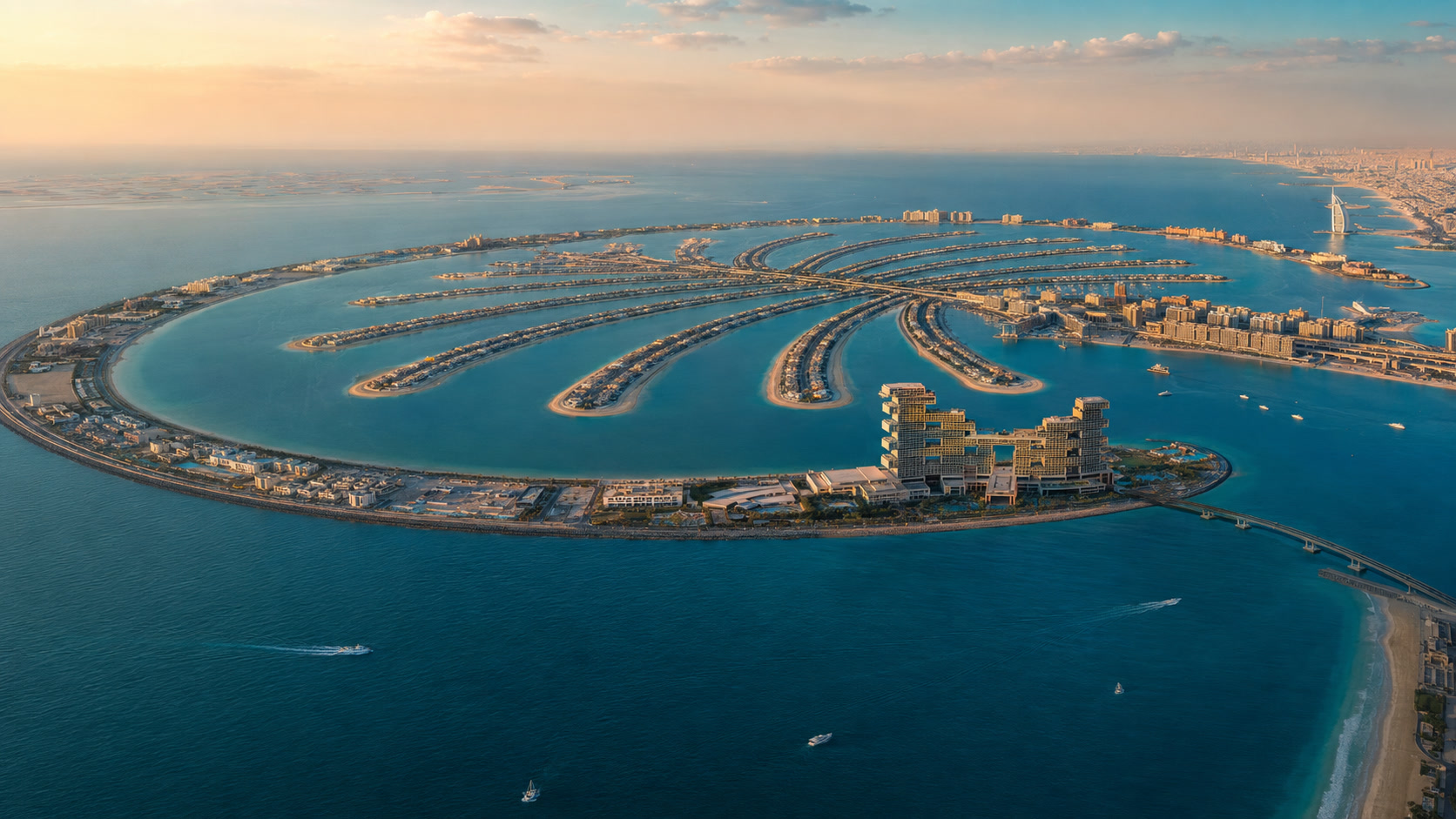 Sunlit aerial view of Palm Jumeirah and Dubai’s residential coastline